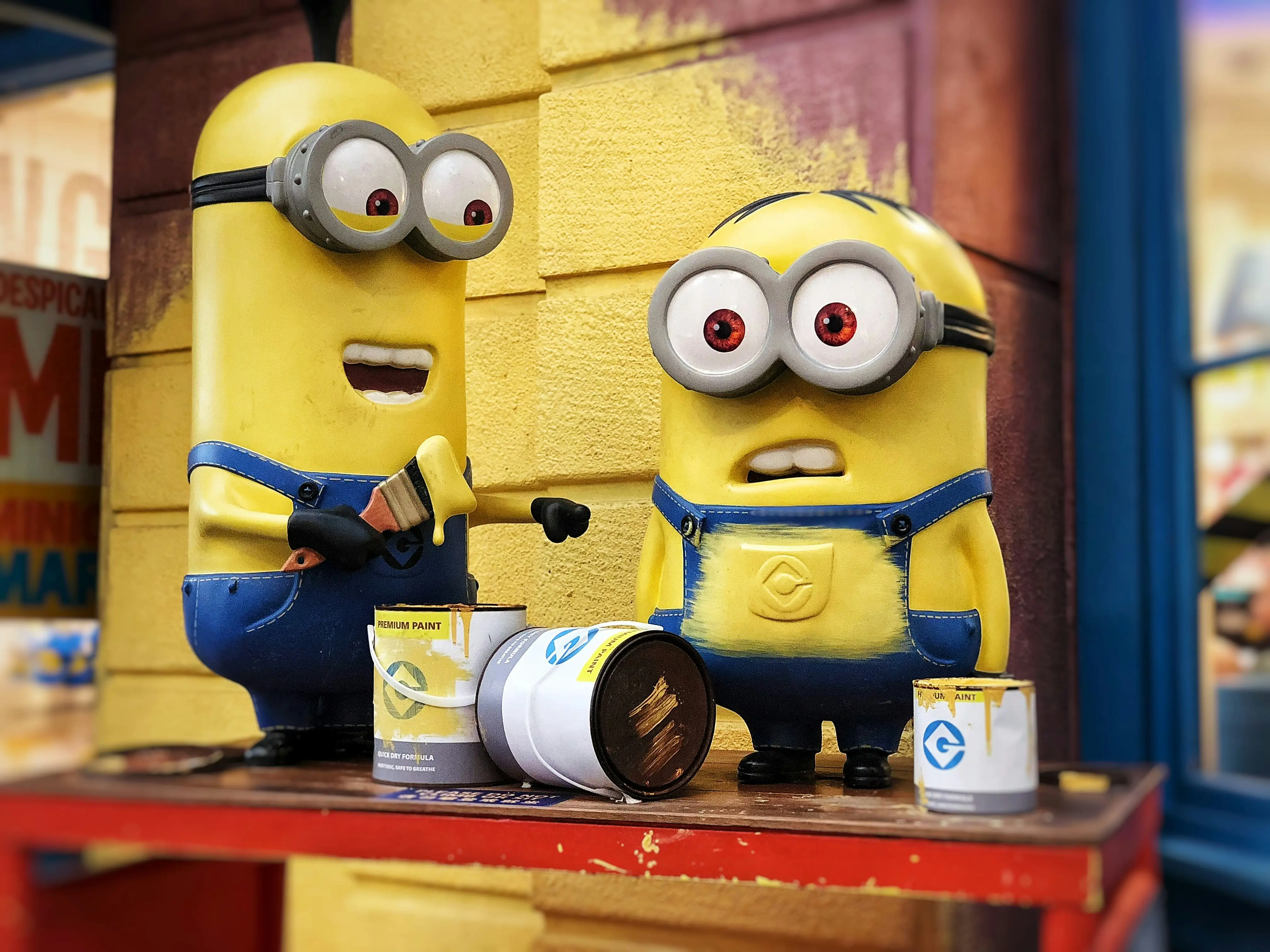 Two Minions Painting a Wall